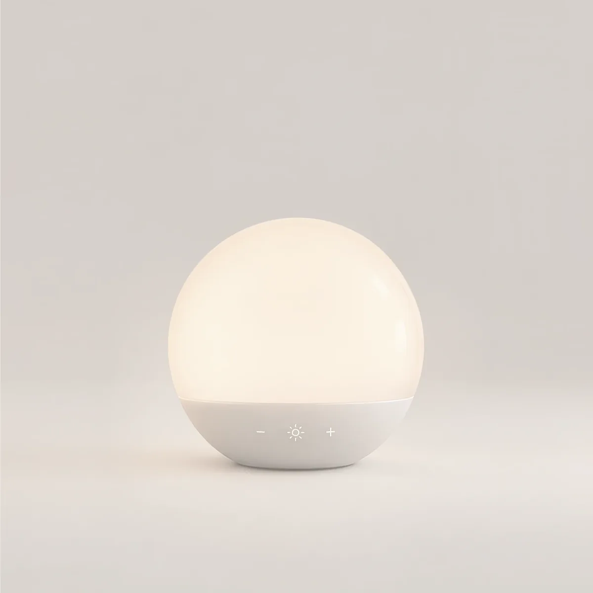 A round sunrise alarm lamp glowing warm